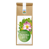 Bio-Jahreszeitentee Frühlingsdüfte von Kräutergarten Pommerland – schwungvolle, erneuernde Kräuterteemischung in brauner Papierverpackung mit grünem Etikett und Blütenmotiv.