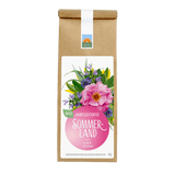 Bio-Jahreszeitentee Sommerland von Kräutergarten Pommerland – leichte und erfrischende Kräuterteemischung in brauner Papierverpackung mit pinkem Etikett.