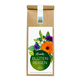 Bio-Klassiker Blütenreigen von Kräutergarten Pommerland – fröhlich und beflügelnd, bunte Kräuter- und Blütenmischung in brauner Papiertüte mit grünem Etikett.