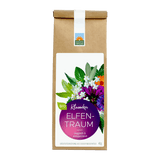 Bio Kräutertee Elfentraum in brauner Papiertüte mit weißem Etikett, violettem Rundlabel und bunter Kräuter- und Blütenmischung; Hinweis ‚magisch & entspannend‘.