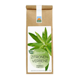 Bio Kräutertee Zitronenverbene in brauner Papiertüte mit weißem Etikett, grünem Rundlabel und frischen Zitronenverbene-Blättern; aromatisch & ausgleichend.