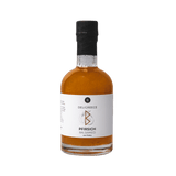 Freigestellte Pfirsich-Balsamico Flasche