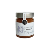 DELIGREECE Grapefruit Marmelade im Glas – 85 % frische Früchte, goldener Deckel, weißes Etikett mit Grapefruit-Illustration.